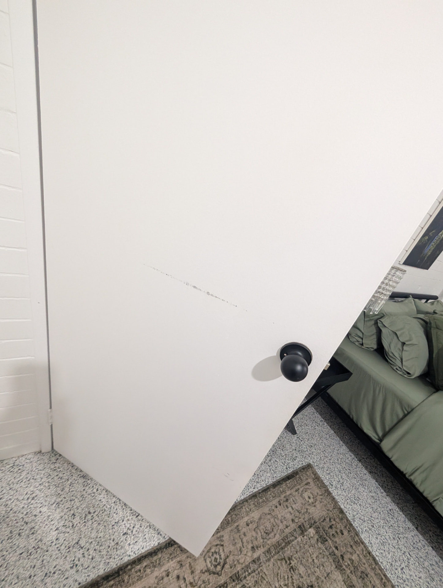 Entry · scuffed door and frame captured 2026-03-03 10:58:00 GMT+10